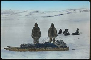 Image of Two Eskimos [Inuit] with Dog Team in Baffin Land